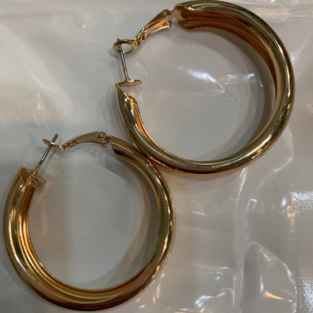 Never worn chunky gold hoop earrings.